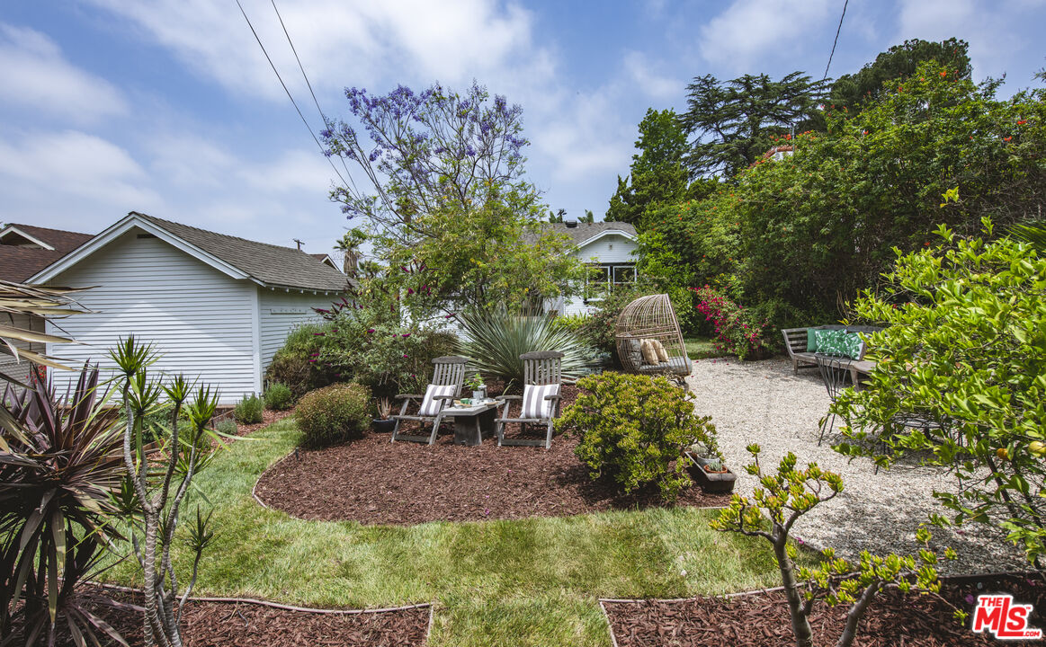 2124 Ridgeview Avenue Los Angeles, CA 90041 - Photo 32 of 33 a backyard of a house with lots of green space