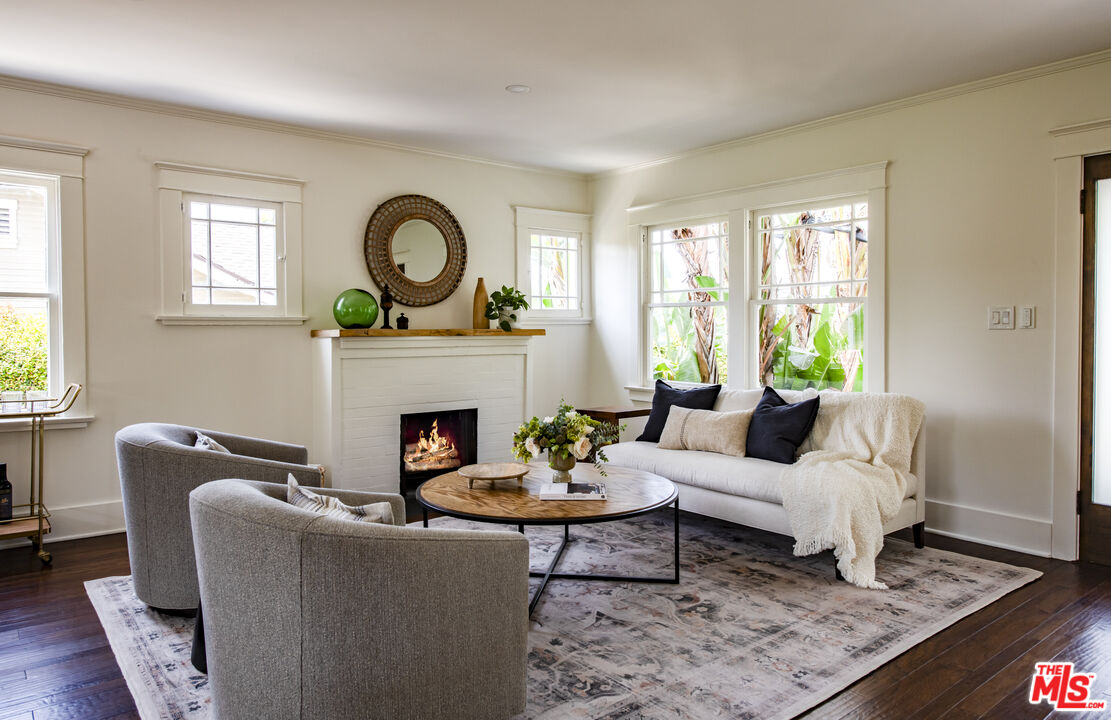 2124 Ridgeview Avenue Los Angeles, CA 90041 - Photo 4 of 33 a living room with furniture a rug a window and a fireplace