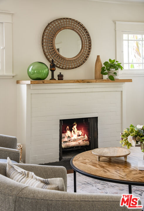 2124 Ridgeview Avenue Los Angeles, CA 90041 - Photo 5 of 33 a living room with furniture and a fireplace