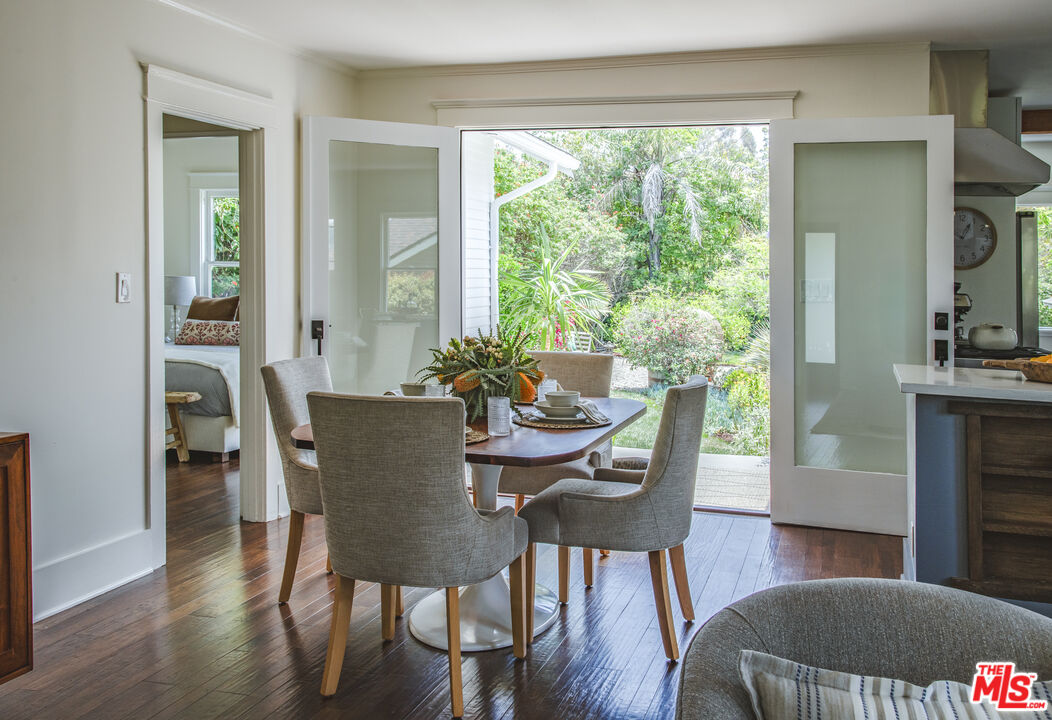 2124 Ridgeview Avenue Los Angeles, CA 90041 - Photo 6 of 33 a dining room with furniture wooden floor and a fireplace