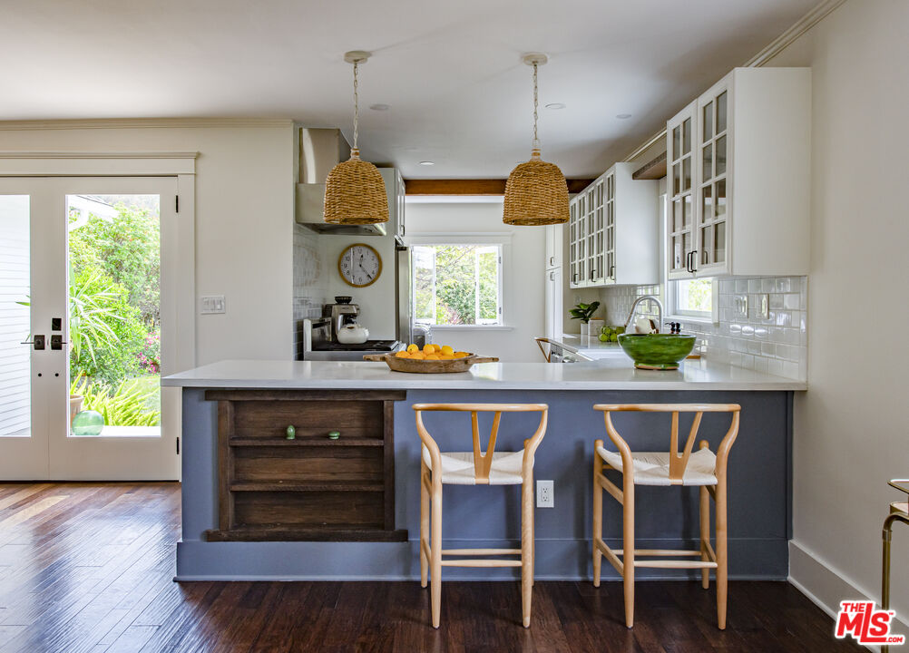2124 Ridgeview Avenue Los Angeles, CA 90041 - Photo 8 of 33 a kitchen with a table chairs sink and cabinets