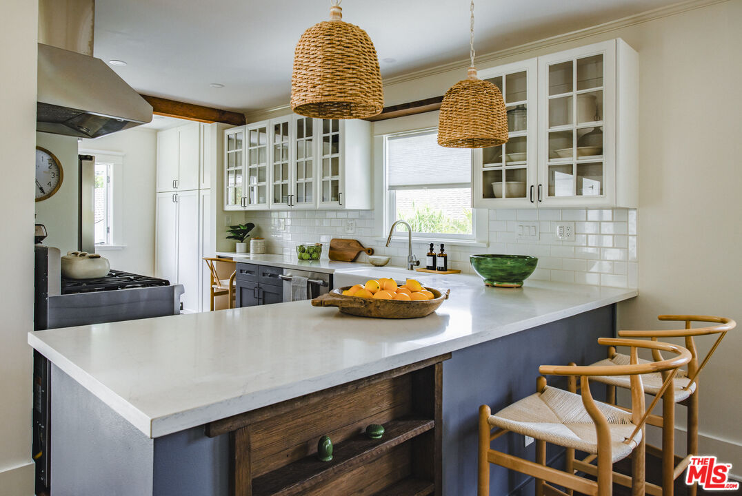 2124 Ridgeview Avenue Los Angeles, CA 90041 - Photo 9 of 33 a kitchen with a table and chairs