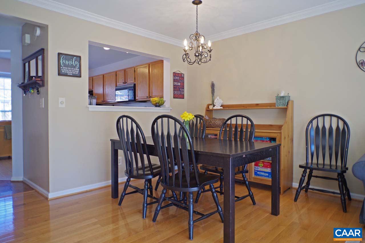 1303 Wimbledon Way Charlottesville, VA 22901 - Photo 12 of 47 a view of a dining room with furniture wooden floor and chandelier