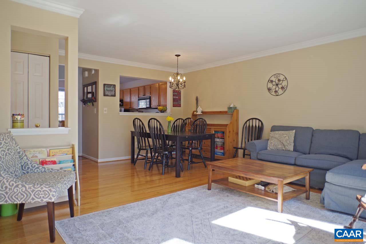 1303 Wimbledon Way Charlottesville, VA 22901 - Photo 13 of 47 a living room with furniture a dining table and a piano table with wooden floor