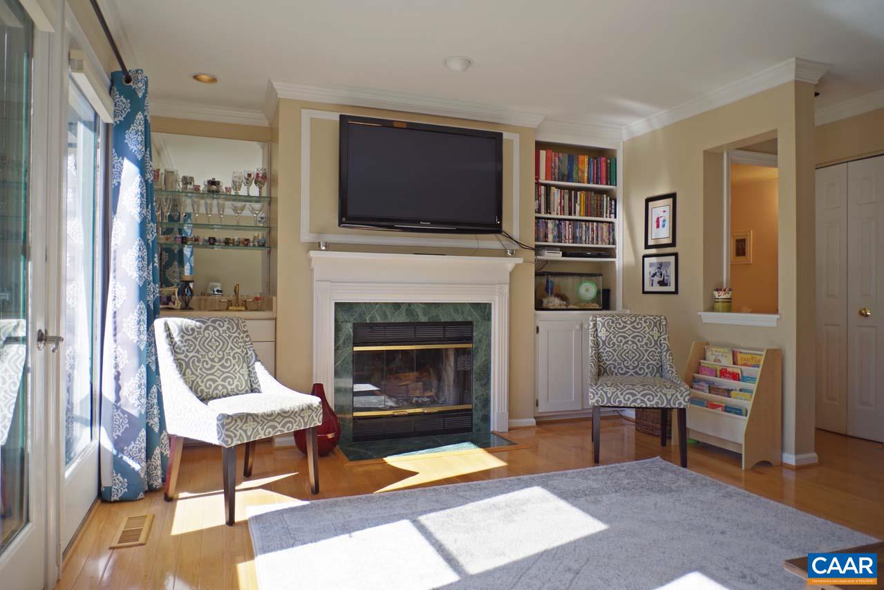 1303 Wimbledon Way Charlottesville, VA 22901 - Photo 15 of 47 a living room with furniture fireplace and flat screen tv