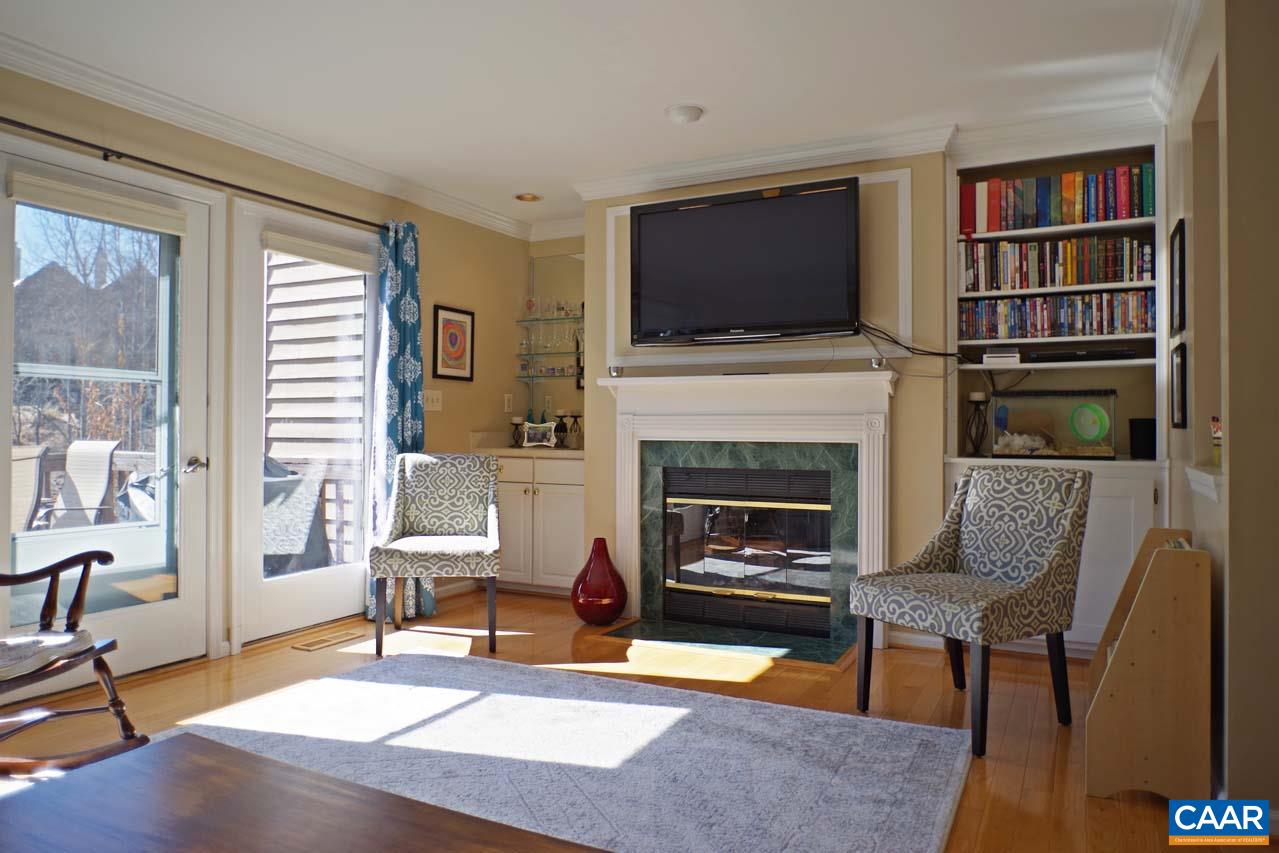 1303 Wimbledon Way Charlottesville, VA 22901 - Photo 16 of 47 a living room with furniture fireplace and flat screen tv