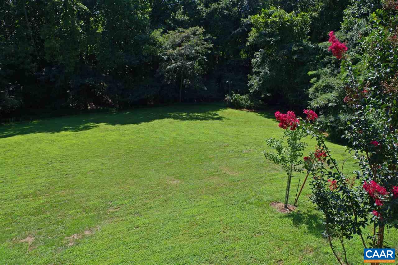 1303 Wimbledon Way Charlottesville, VA 22901 - Photo 18 of 47 a view of a backyard with flowers and trees