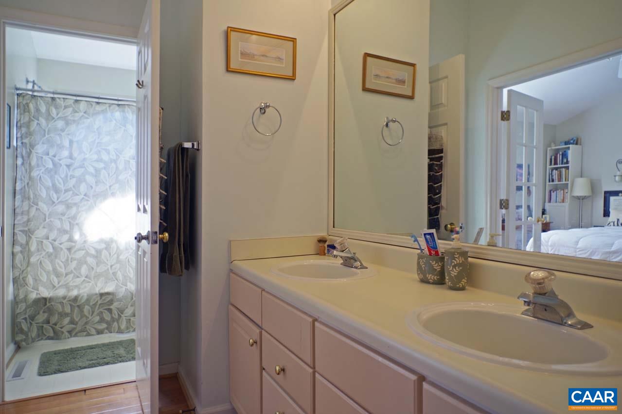 1303 Wimbledon Way Charlottesville, VA 22901 - Photo 29 of 47 a bathroom with a tub sink and mirror