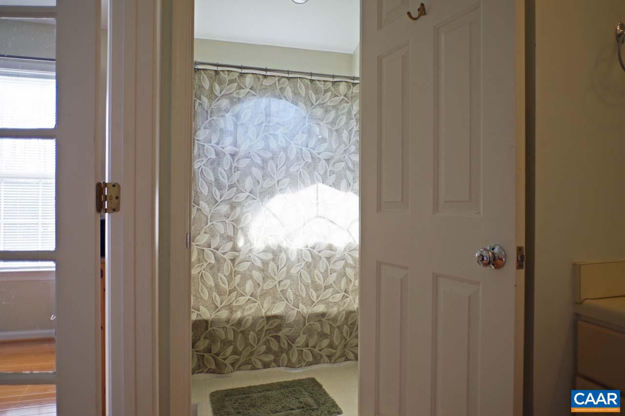 1303 Wimbledon Way Charlottesville, VA 22901 - Photo 31 of 47 a bathroom with a glass shower door