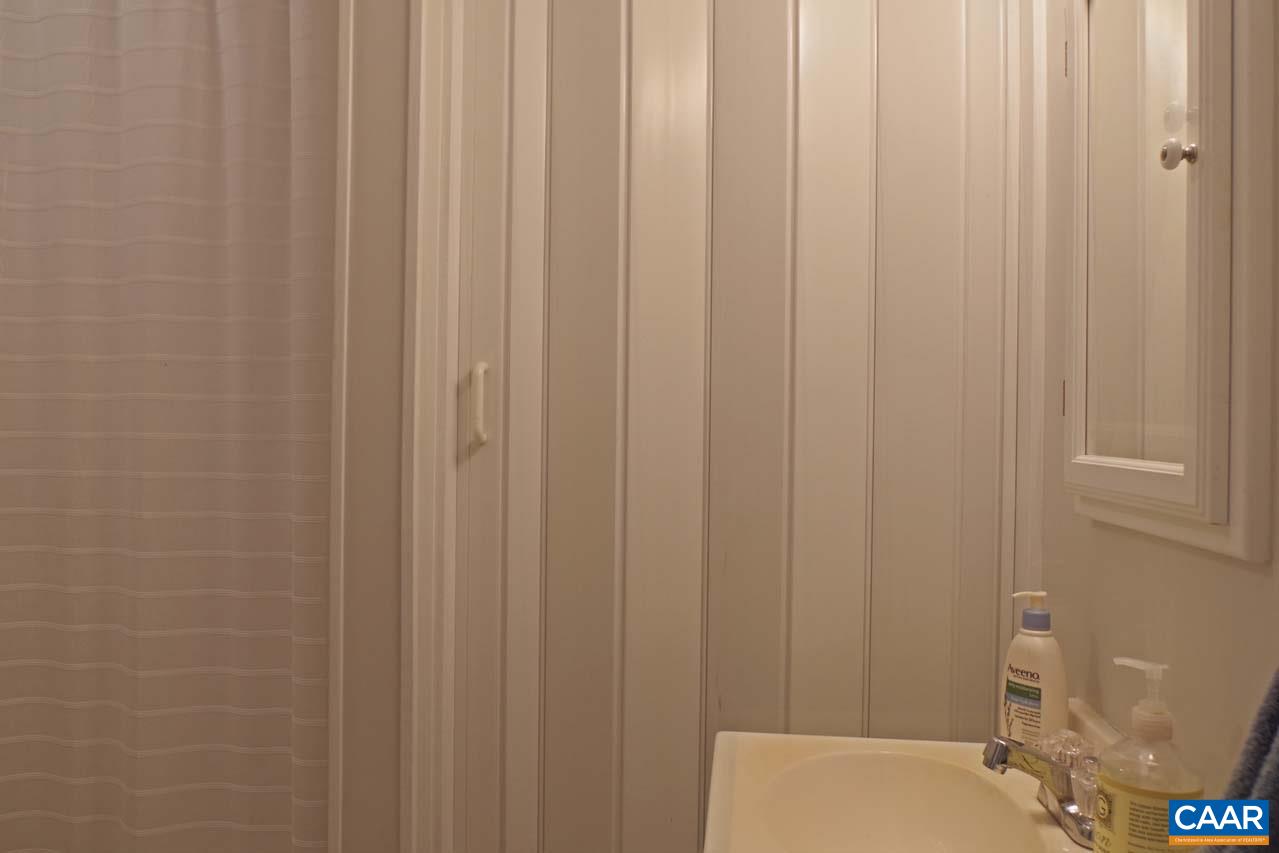 1303 Wimbledon Way Charlottesville, VA 22901 - Photo 42 of 47 a bathroom with a shower curtain
