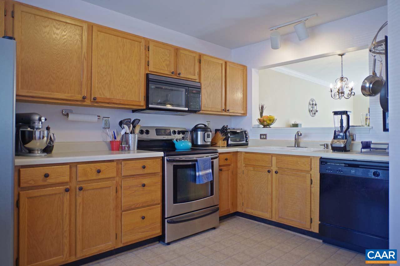 1303 Wimbledon Way Charlottesville, VA 22901 - Photo 6 of 47 a kitchen with cabinets appliances a sink and a window
