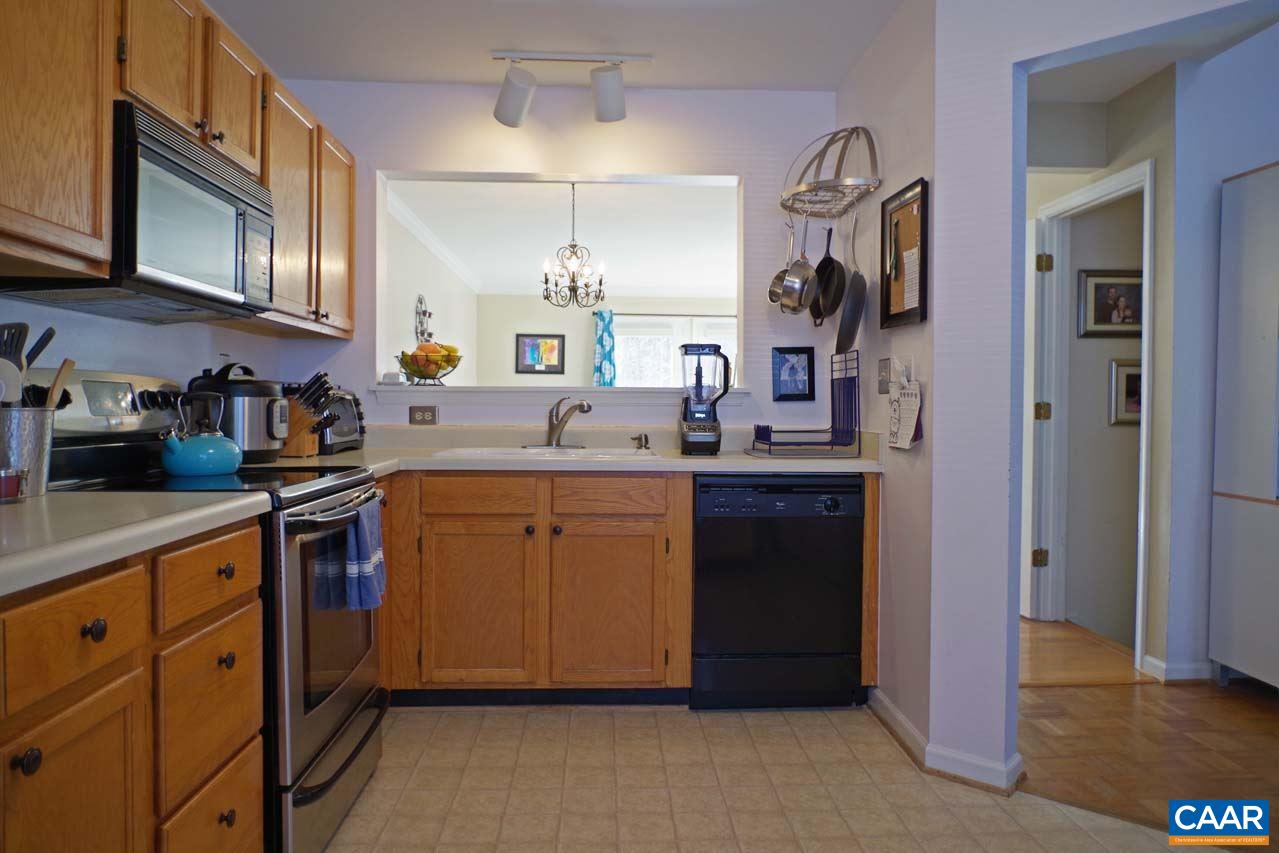 1303 Wimbledon Way Charlottesville, VA 22901 - Photo 10 of 47 a kitchen with stainless steel appliances granite countertop a refrigerator and a sink