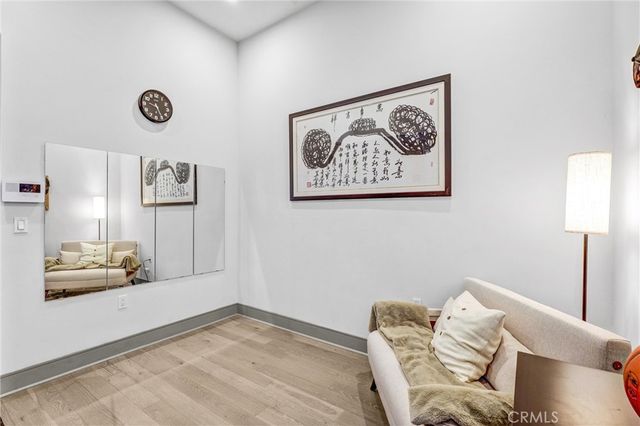 a view of a livingroom with furniture and a window