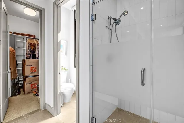 a white bath tub sitting next to a white wall