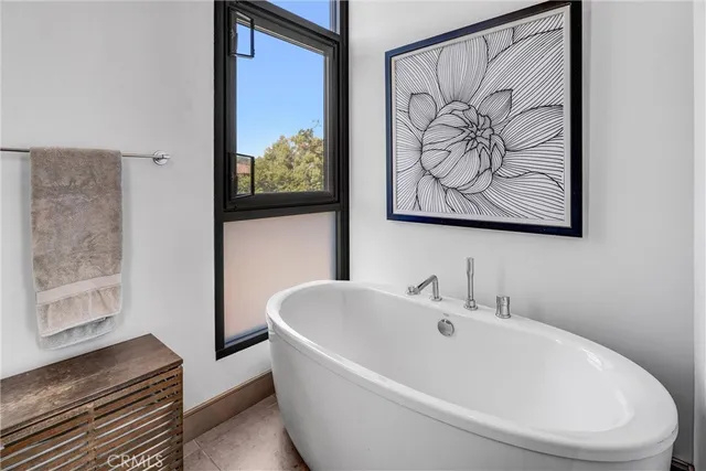 a spacious bathroom with a double vanity sink mirror and toilet
