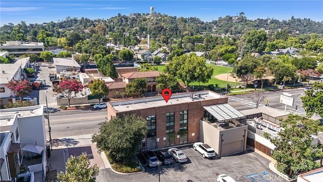 a view of city from balcony with furniture