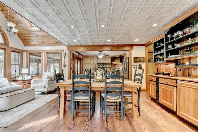 a bed room with a bed mirror and a flat tv screen