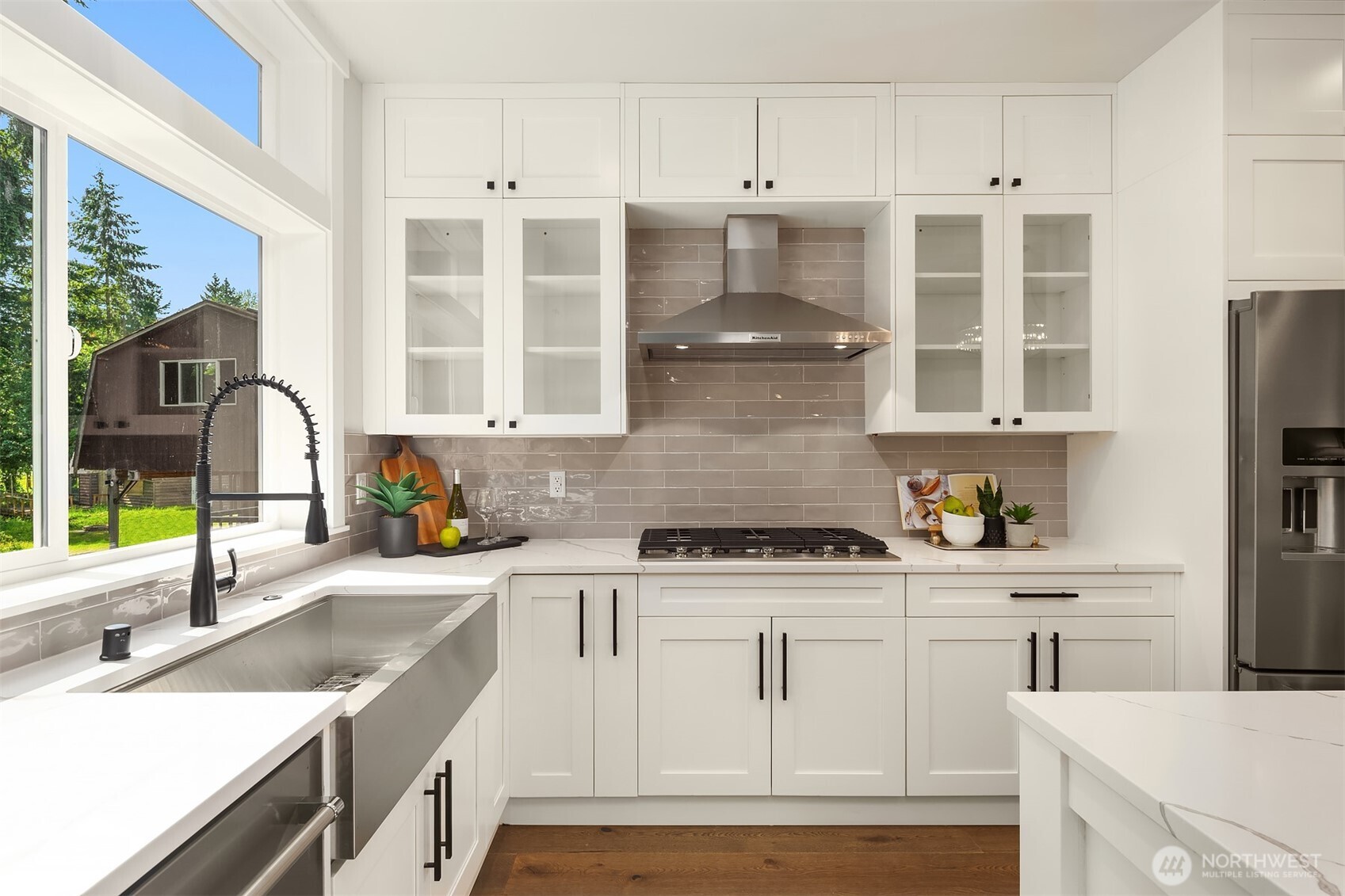 19722 Filbert Drive, Unit 3 Bothell, WA 98012 - Photo 13 of 36 a kitchen with a sink stove and cabinets