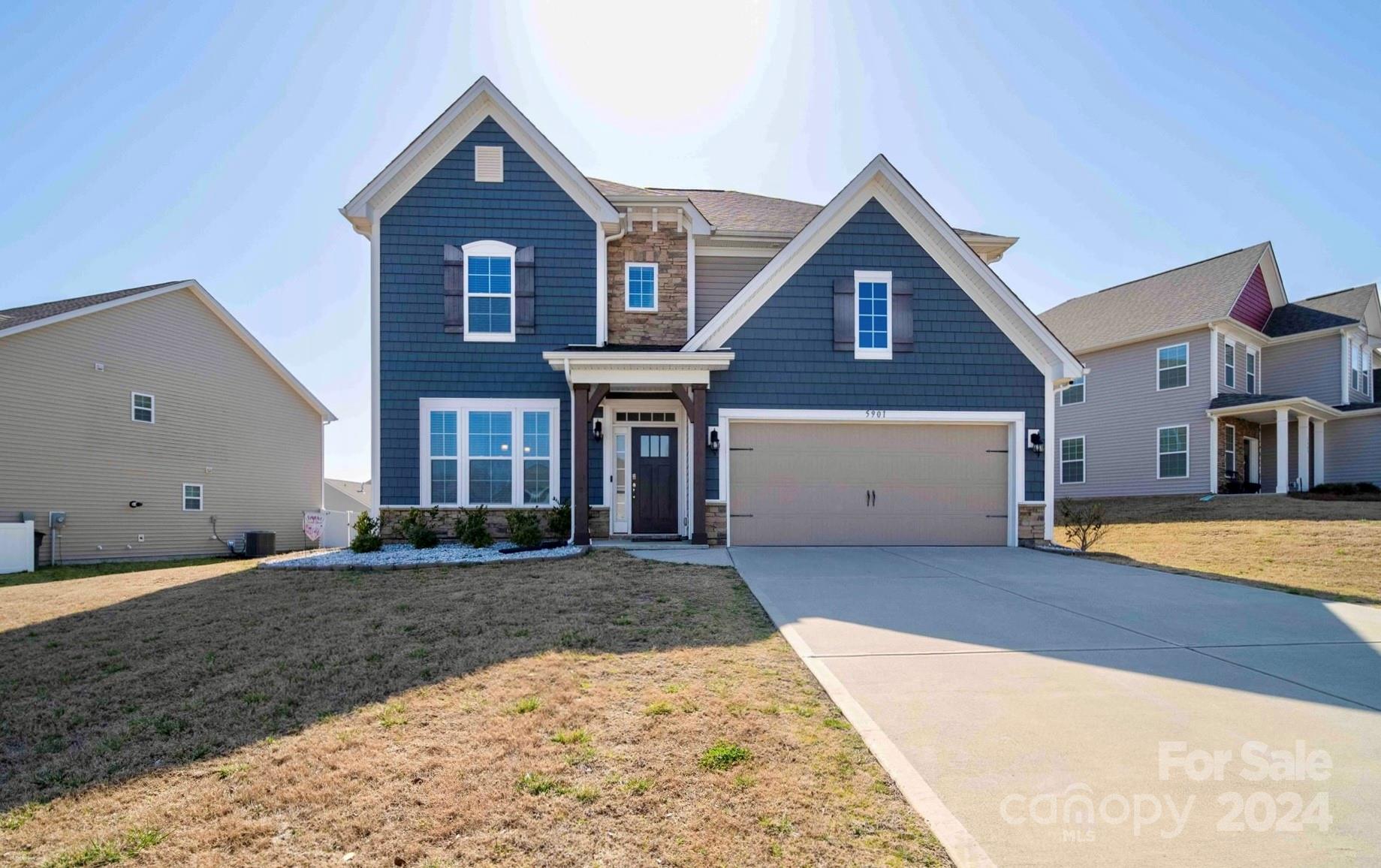 5901 Redwood Pine Road Concord, NC 28027 - Photo 1 of 39 a front view of a house with a yard