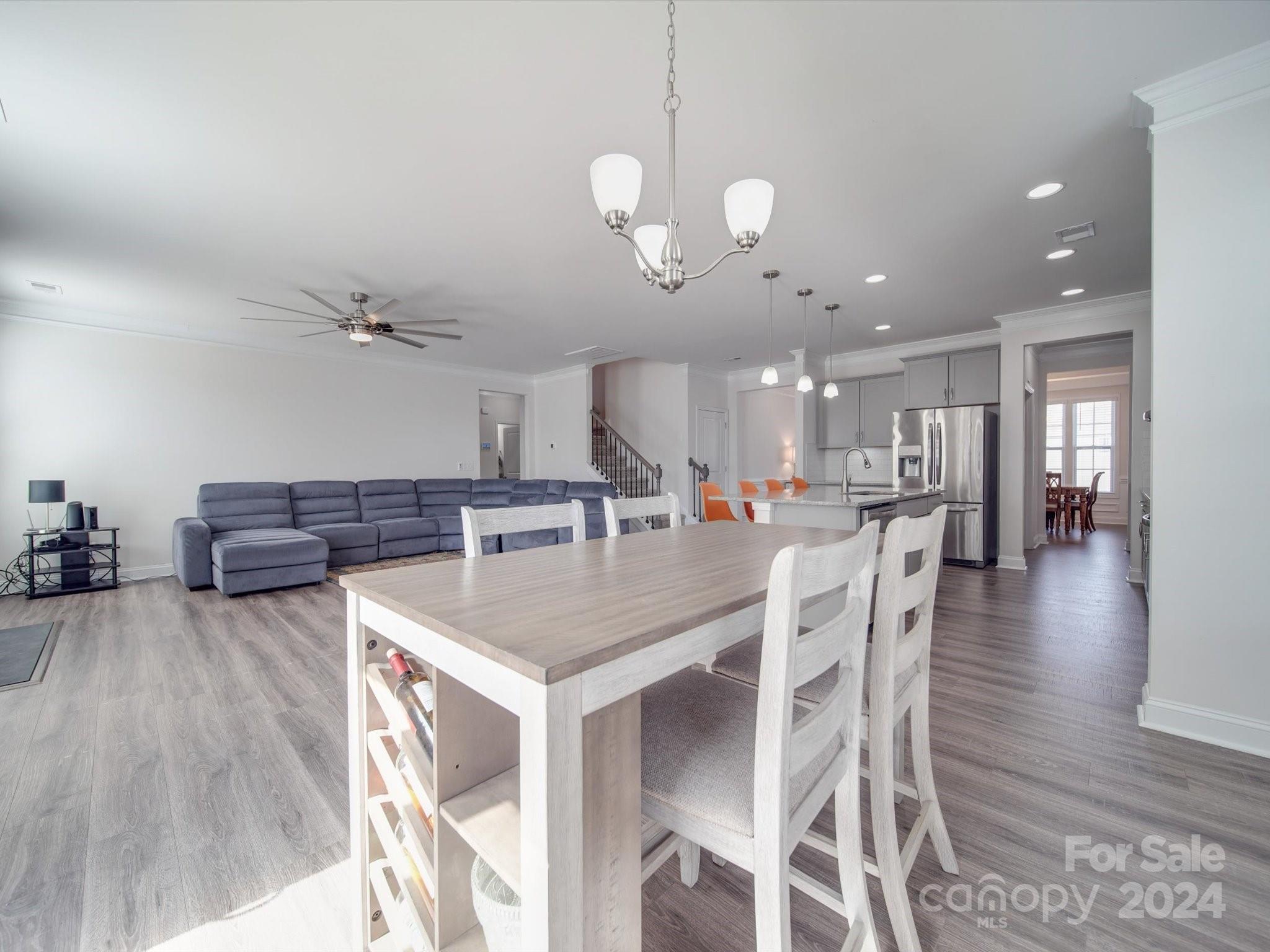 5901 Redwood Pine Road Concord, NC 28027 - Photo 16 of 39 a large kitchen with a table and chairs