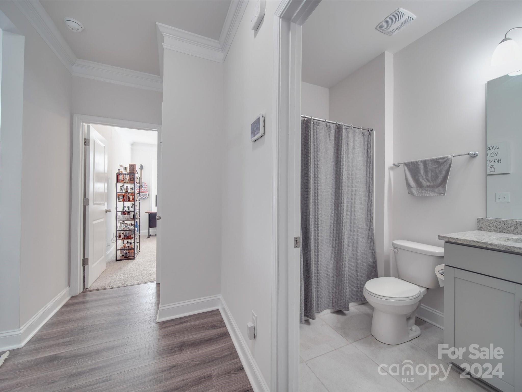 5901 Redwood Pine Road Concord, NC 28027 - Photo 20 of 39 a bathroom with a toilet and a shower