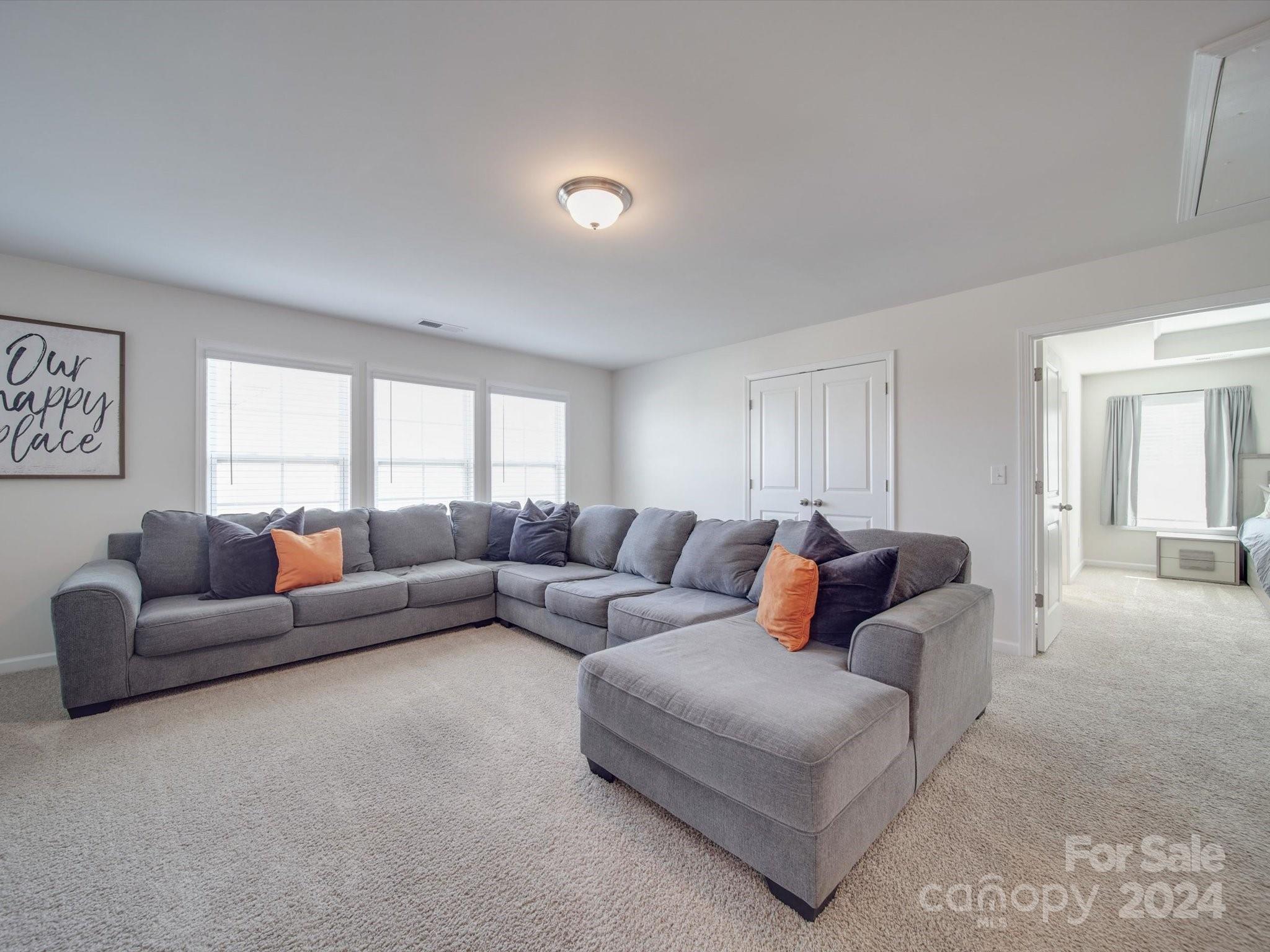 5901 Redwood Pine Road Concord, NC 28027 - Photo 26 of 39 a living room with furniture and a couch