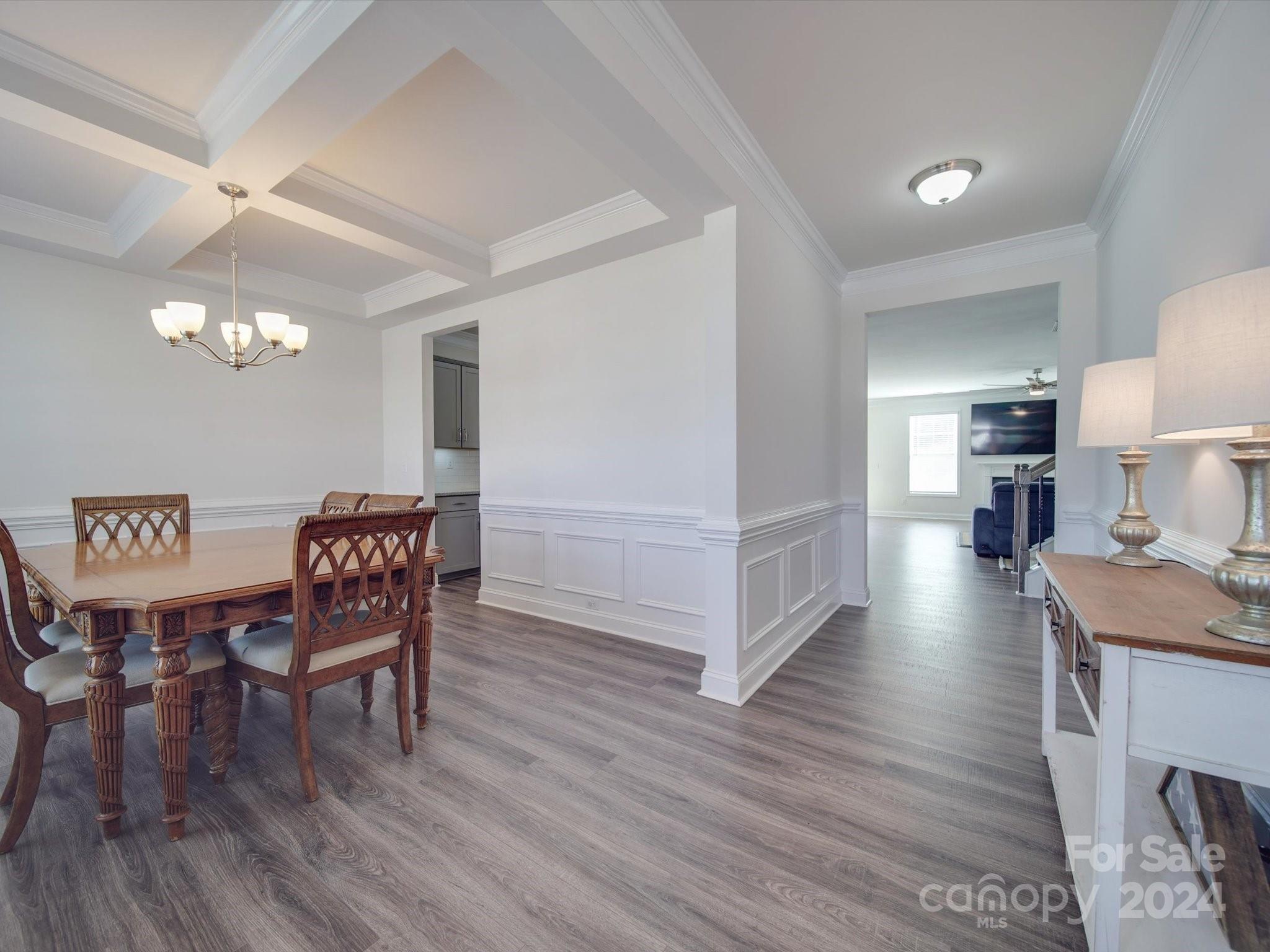 5901 Redwood Pine Road Concord, NC 28027 - Photo 4 of 39 a view of a dining room with furniture and wooden floor