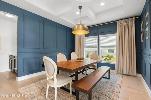 a kitchen with stainless steel appliances kitchen island a sink and cabinets
