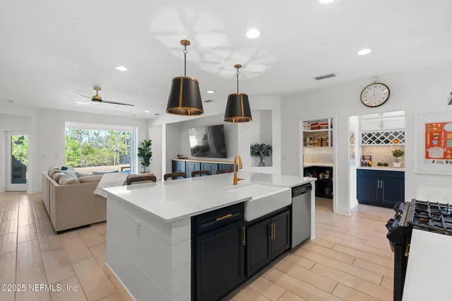 a spacious bedroom with a bed and a flat screen tv