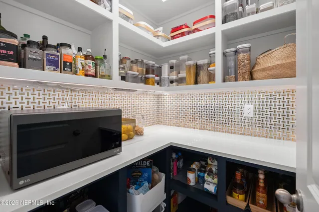 a bathroom with a sink a mirror and a toilet
