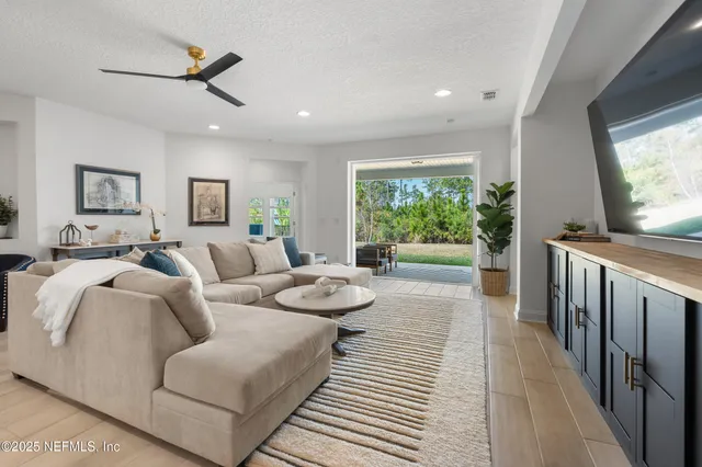 a view of walk in closet with clothes
