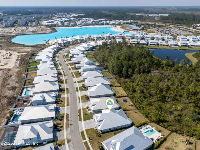 a view of a house with a backyard porch and sitting area
