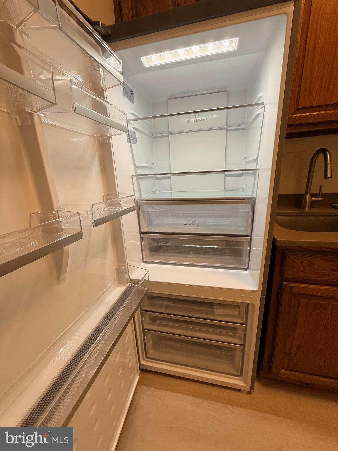 4740 Connecticut Avenue Northwest, Unit 112 Washington, DC 20008 - Photo 16 of 20 Modern fridge with ample storage space.