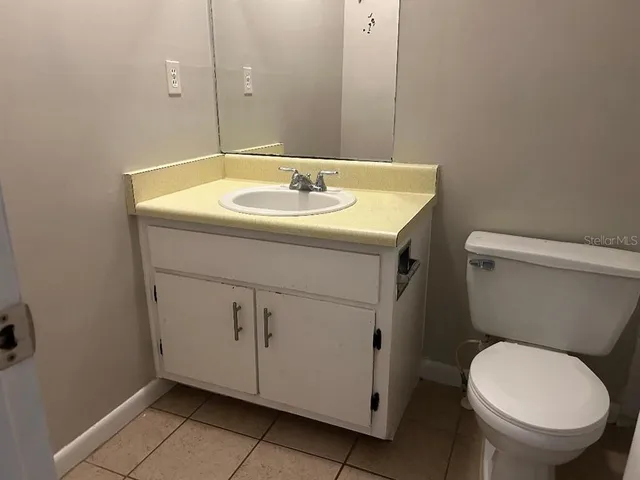 an empty room with windows and entrance