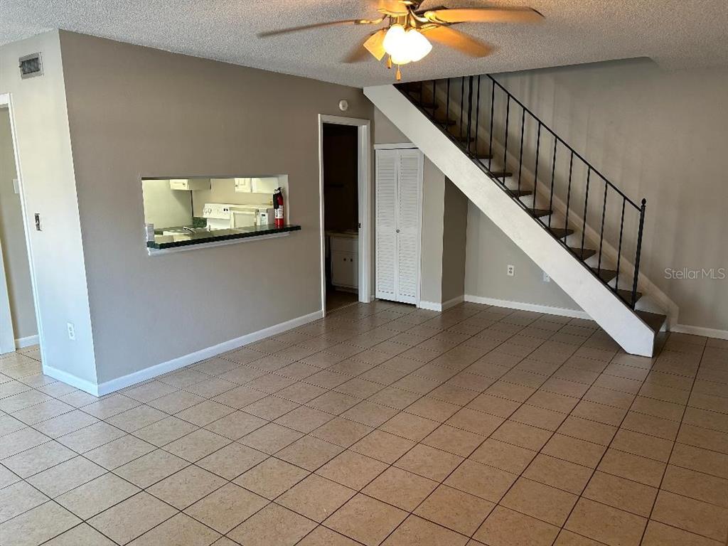 5582 Green Shadows Place, Unit 202 Orlando, FL 32811 - Photo 6 of 19 a view of a livingroom with furniture