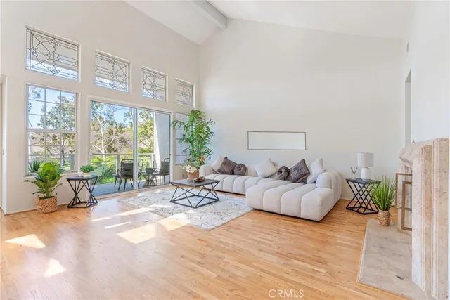 a living room with furniture and windows