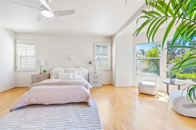 a spacious bathroom with a granite countertop sink mirror and shower
