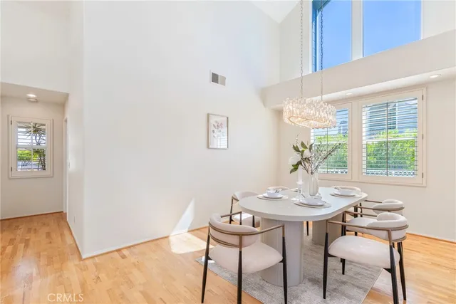 a living room with furniture a fireplace and a table
