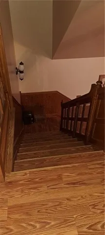 a view of a living room and wooden floor