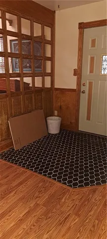 a bathroom with a toilet and a mirror