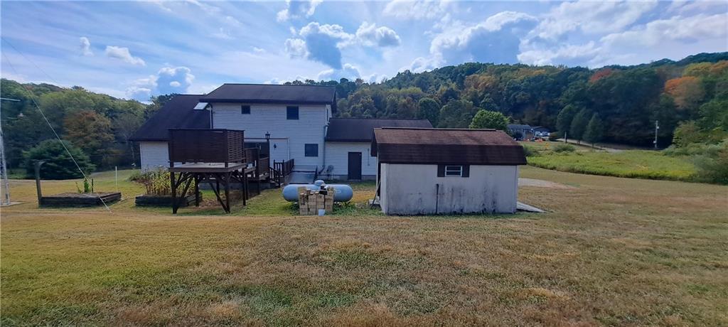 1825 Robertsville Road Punxsutawney, PA 15767 - Photo 6 of 22 a view of a house with a yard and sitting area