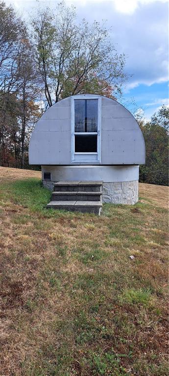 1825 Robertsville Road Punxsutawney, PA 15767 - Photo 10 of 22 a backyard of a house with lots of green space