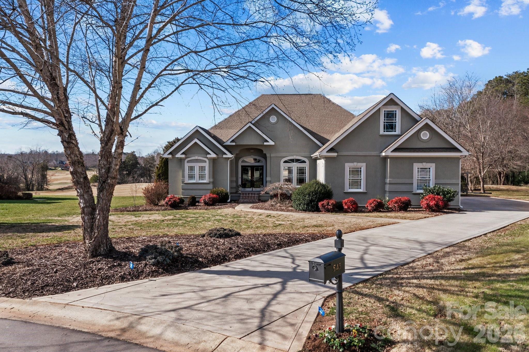 a front view of a house with yard