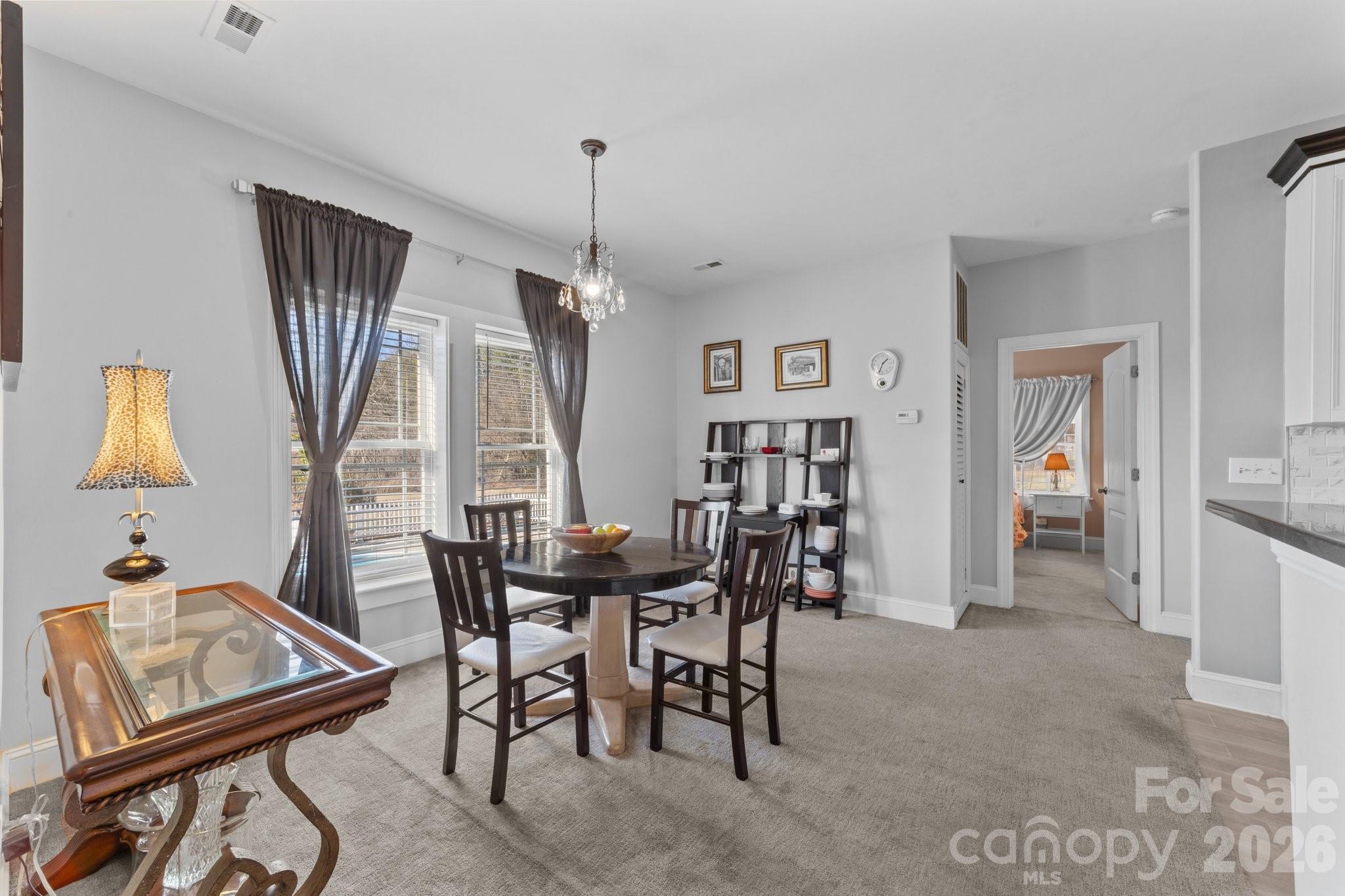 543 Muirfield Way Salisbury, NC 28144 - Photo 13 of 42 a view of a dining room with furniture and window