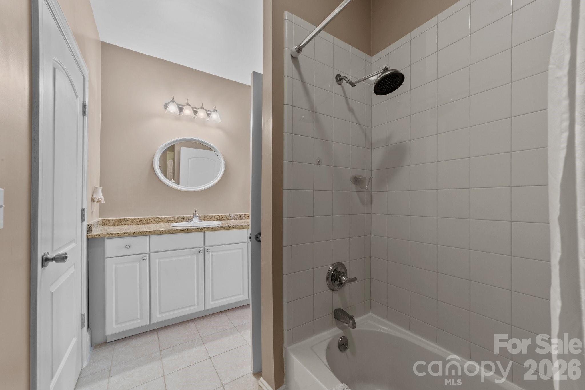 543 Muirfield Way Salisbury, NC 28144 - Photo 20 of 42 a bathroom with a granite countertop sink a toilet and shower
