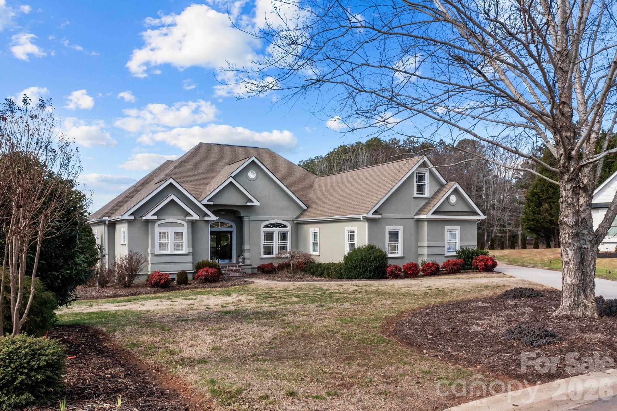 543 Muirfield Way Salisbury, NC 28144 - Photo 2 of 42 a front view of a house with a garden