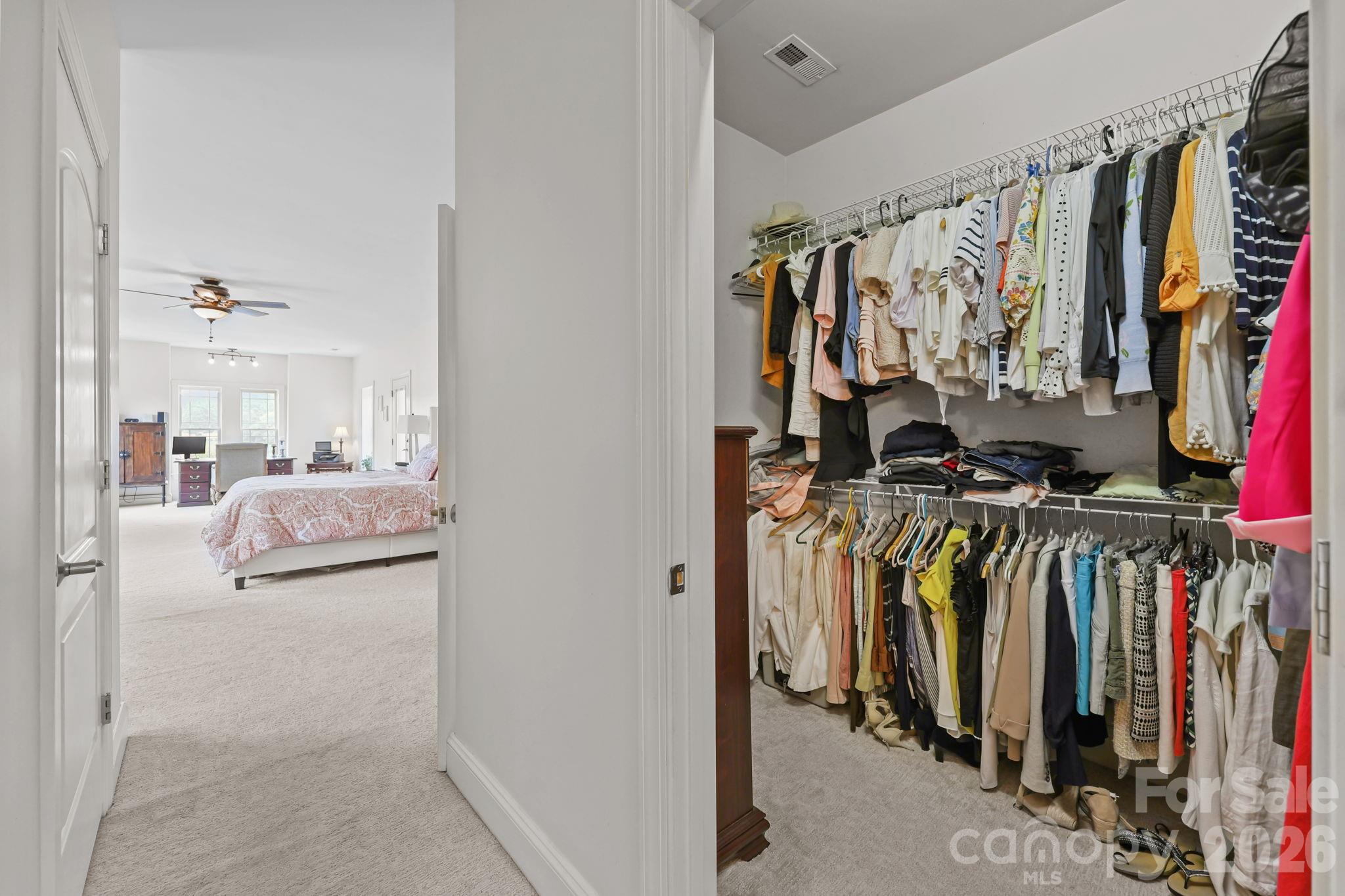 543 Muirfield Way Salisbury, NC 28144 - Photo 29 of 42 a view of walk in closet with clothes and shoes