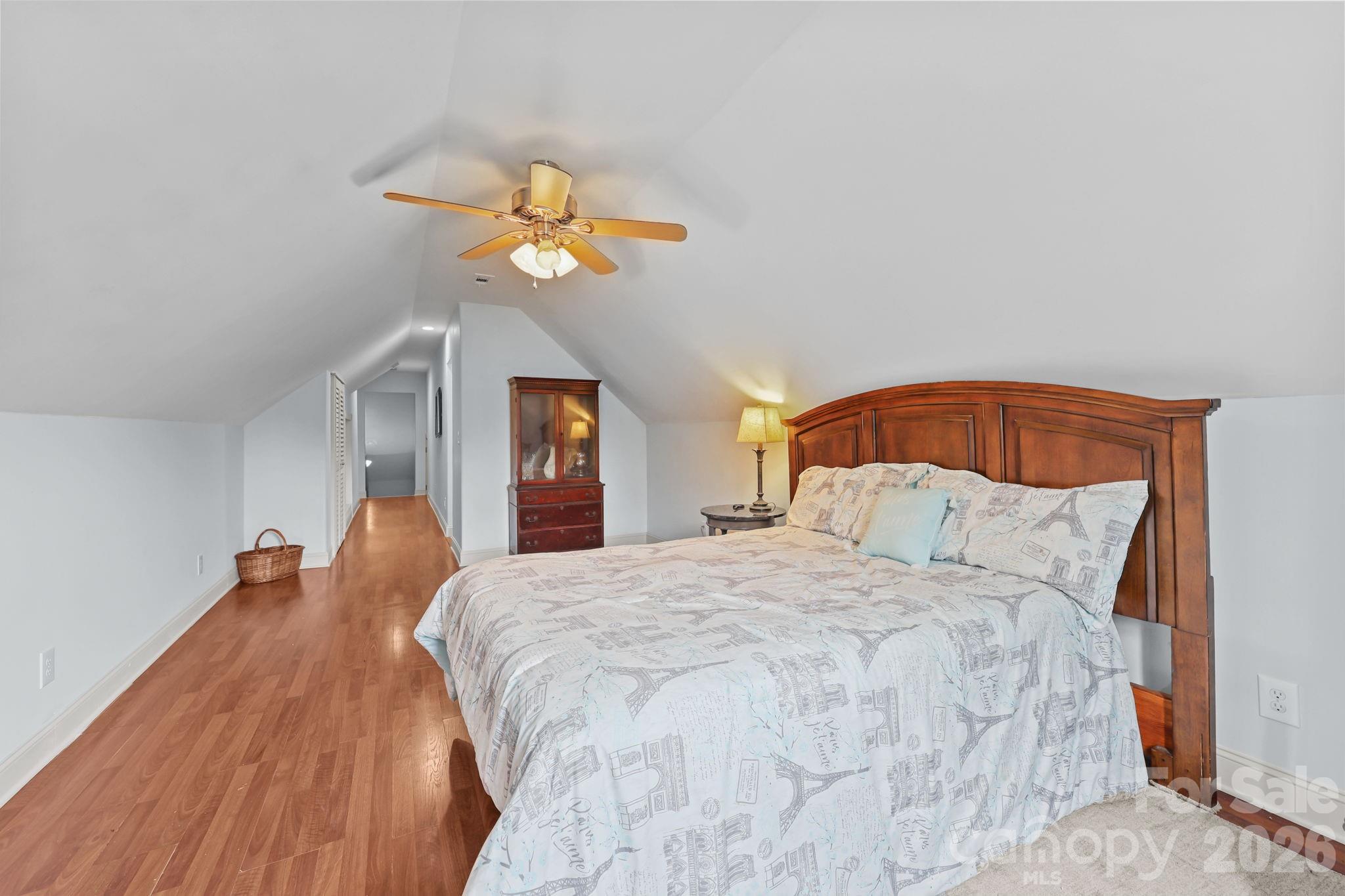 543 Muirfield Way Salisbury, NC 28144 - Photo 31 of 42 a bedroom with a bed and a chandelier