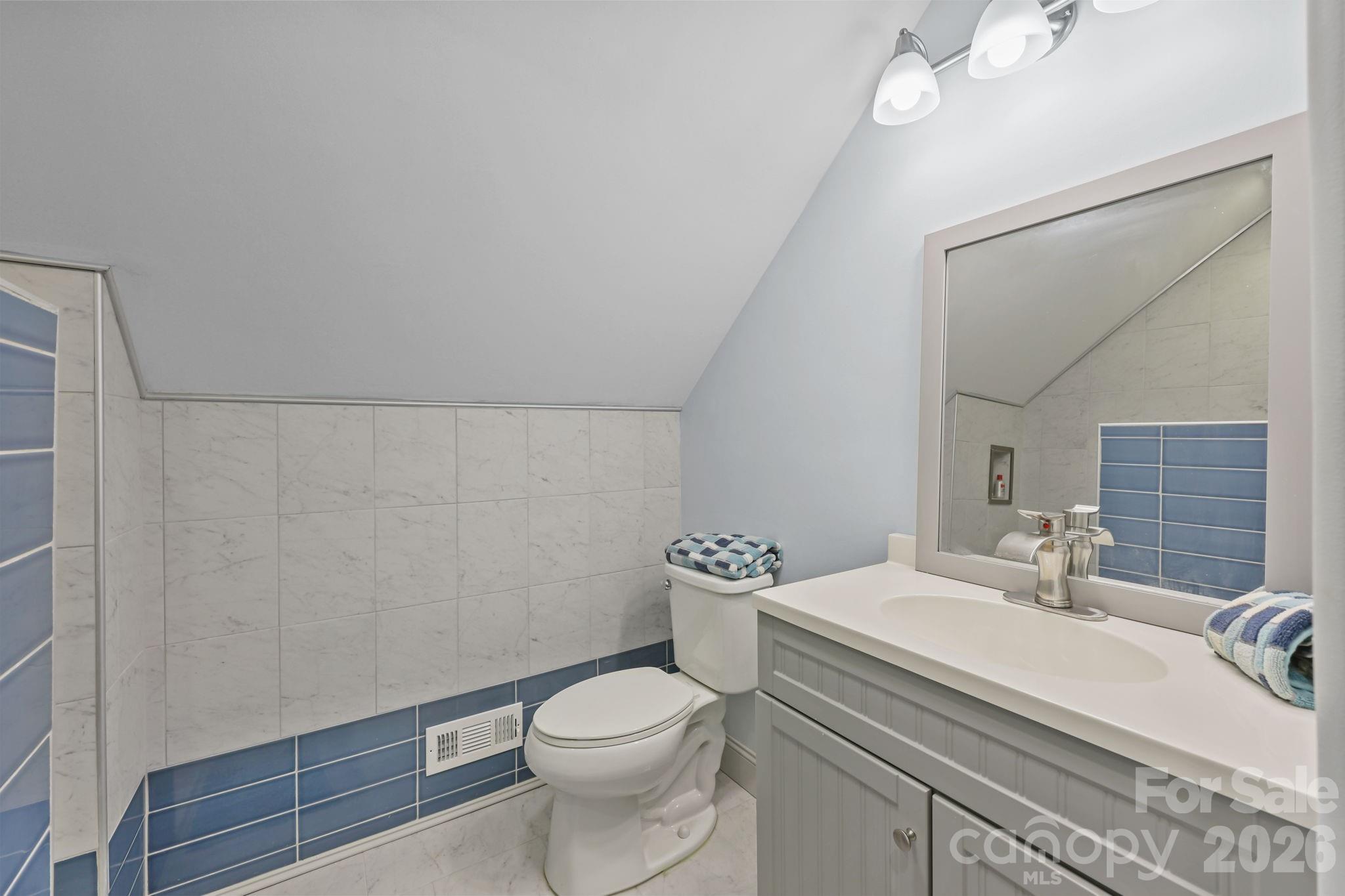 543 Muirfield Way Salisbury, NC 28144 - Photo 33 of 42 a bathroom with a sink a toilet and mirror