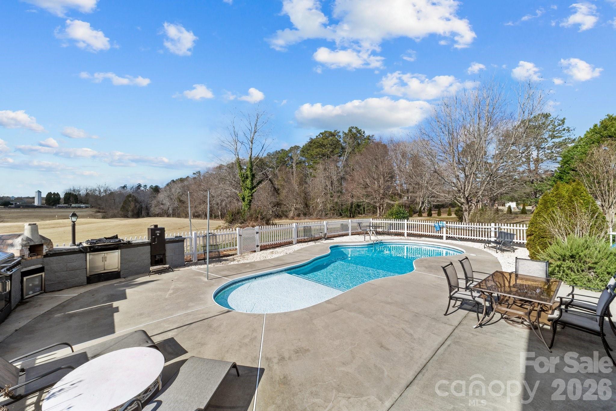 543 Muirfield Way Salisbury, NC 28144 - Photo 39 of 42 a view of a swimming pool with seating space